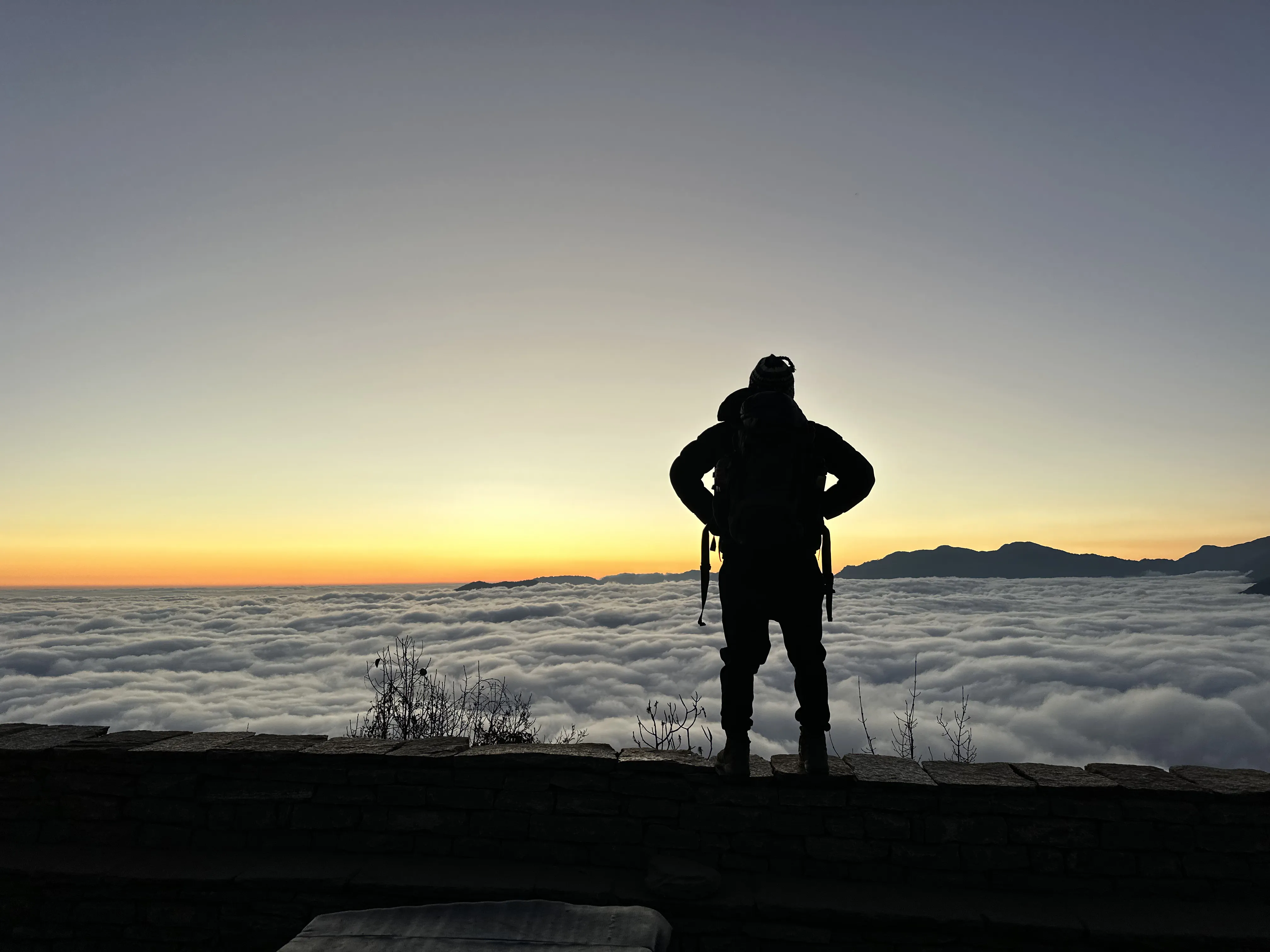 Trekker above the clouds at dawn, Mardi Himal